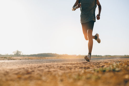 Person running outdoors surrounded by majestic nature